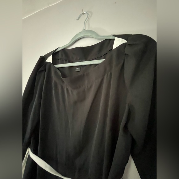 Black and white sheer shirt with a wrap tie belt. - Picture 2 of 5